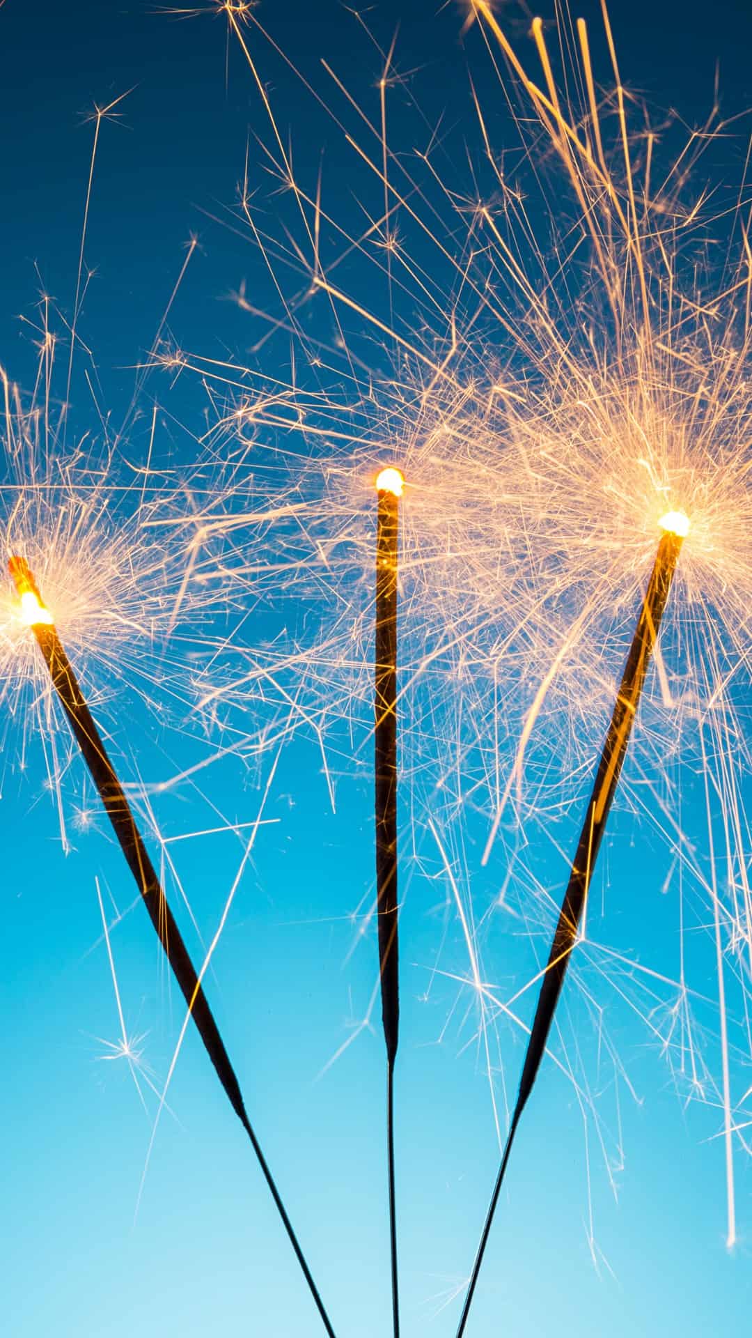 A group of sparklers in the air - New Year, happy