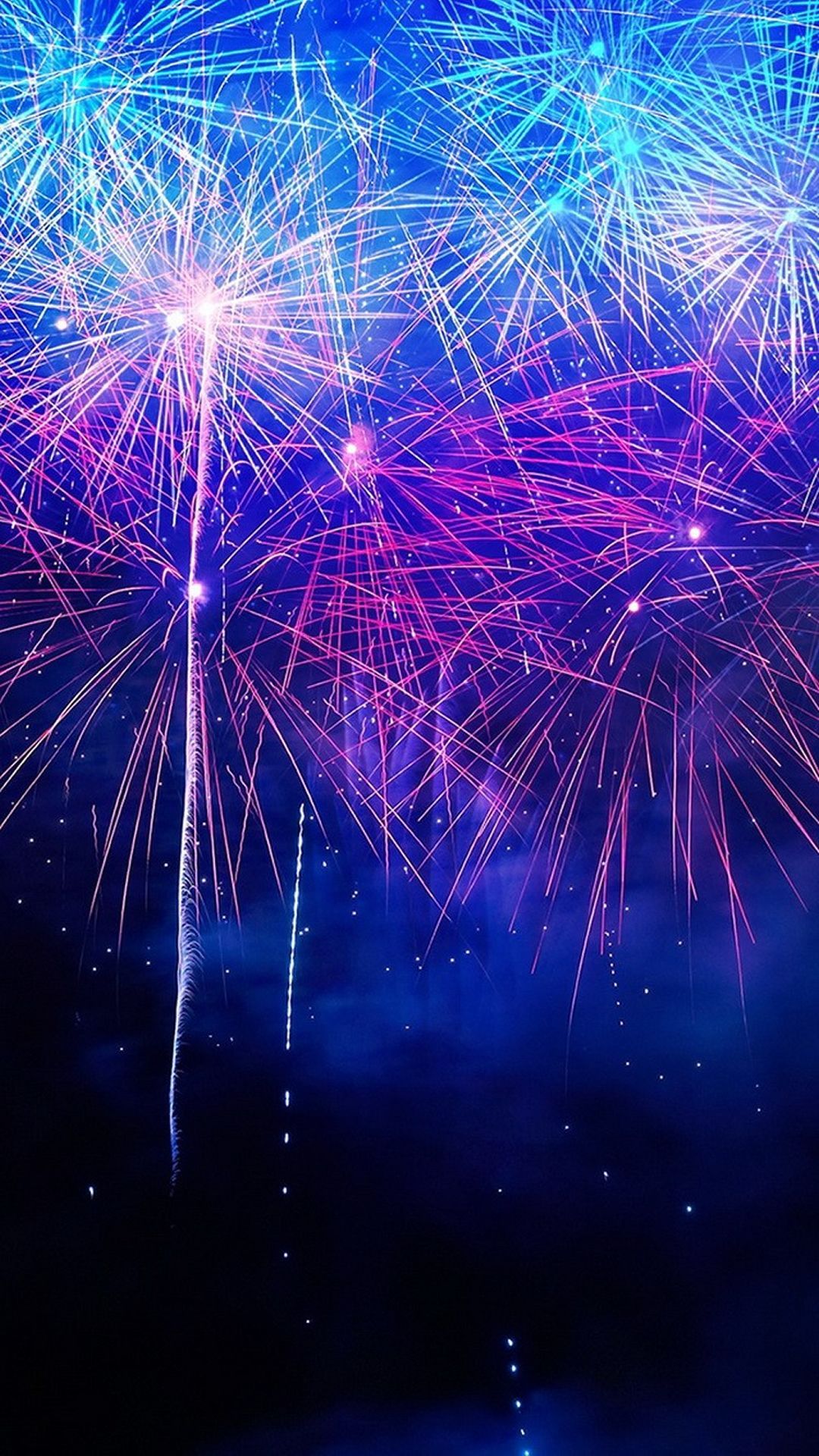 A firework display with bright colors in the sky - New Year