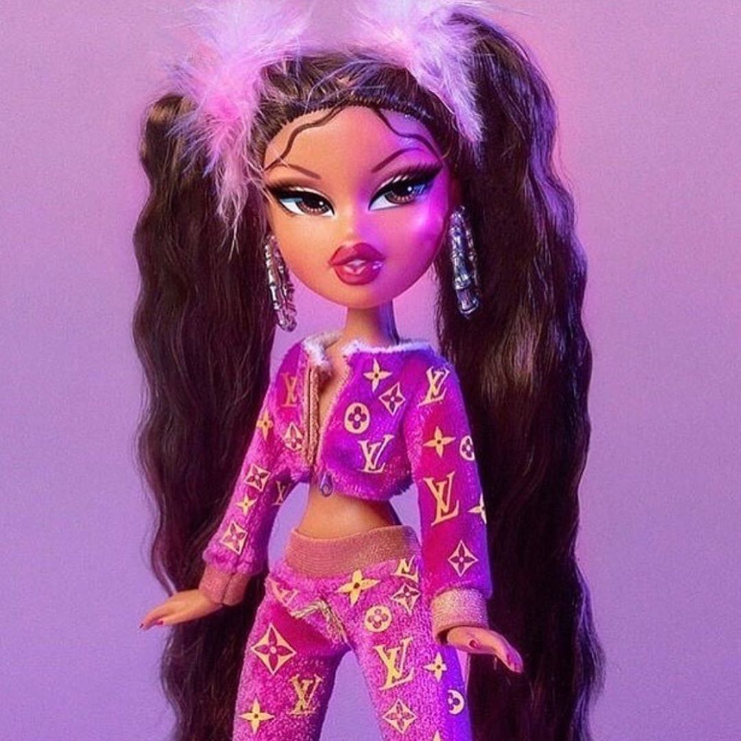 Bratz doll with long hair and a purple outfit - Bratz