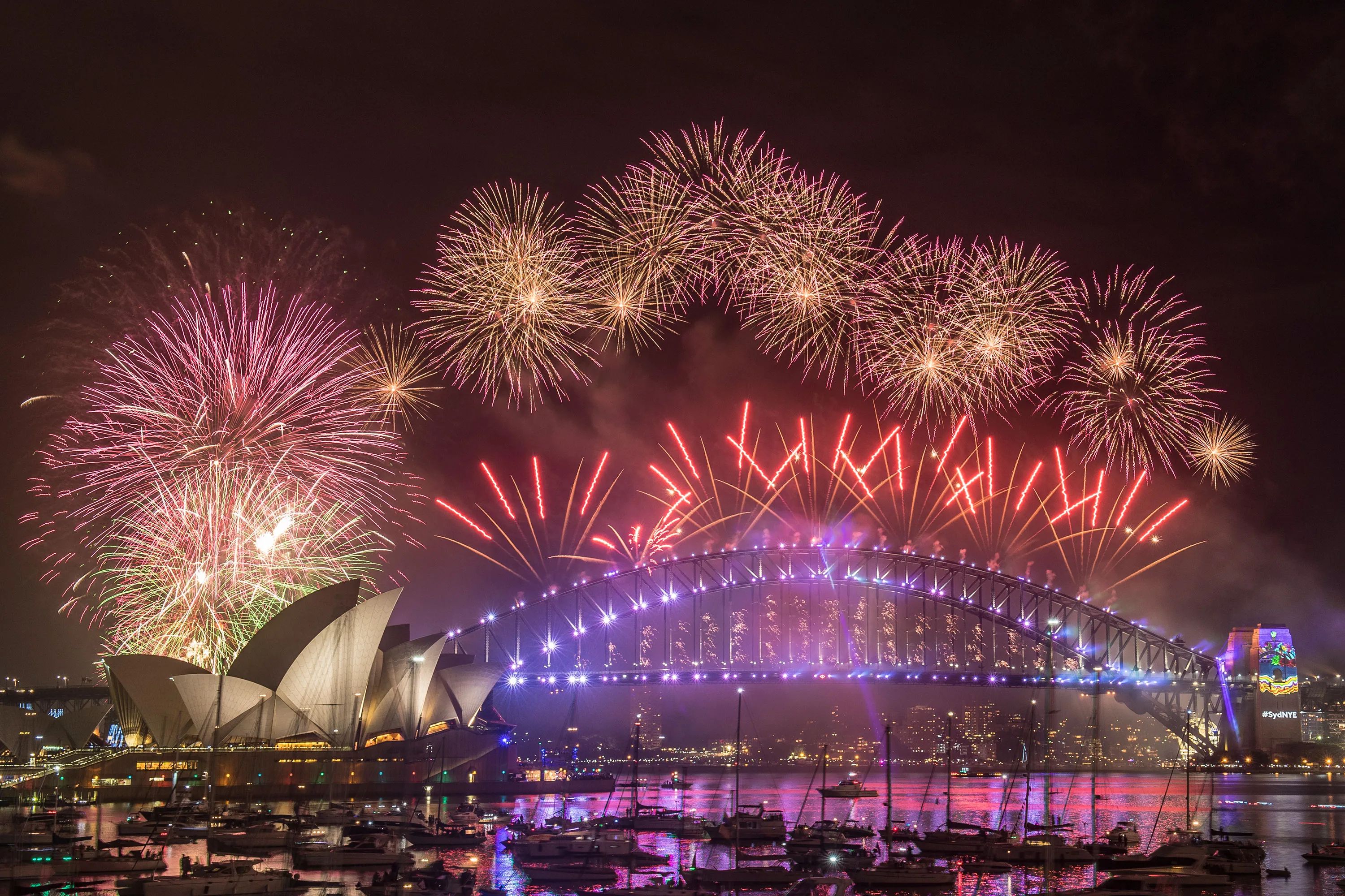 A fireworks display over the harbor in sydney - New Year