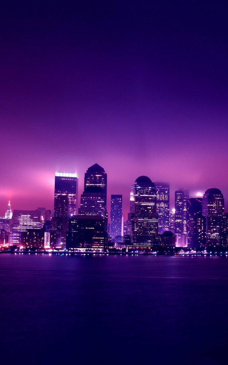 A city skyline at night with purple lighting - Galaxy
