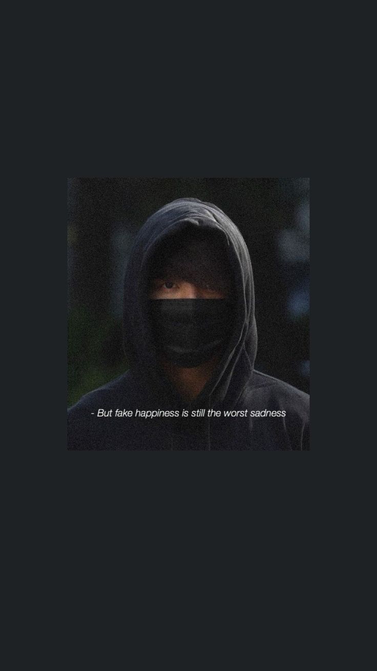 A man with a black hood on and the words 
