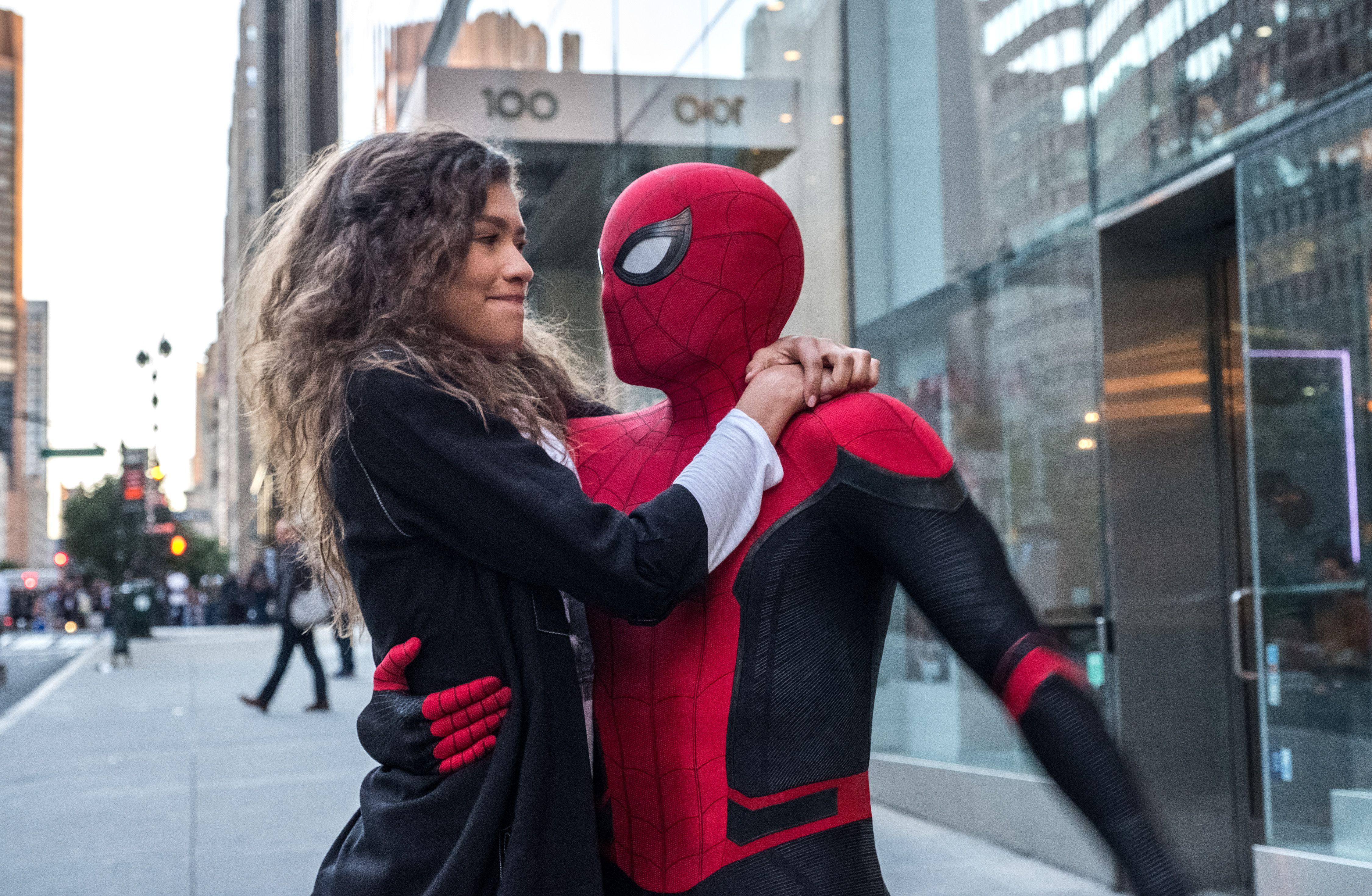 A woman hugging the spider man costume - Tom Holland