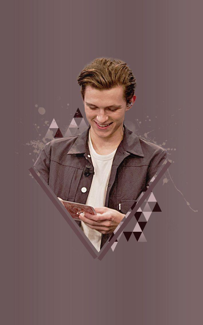 A man is looking at his phone - Tom Holland