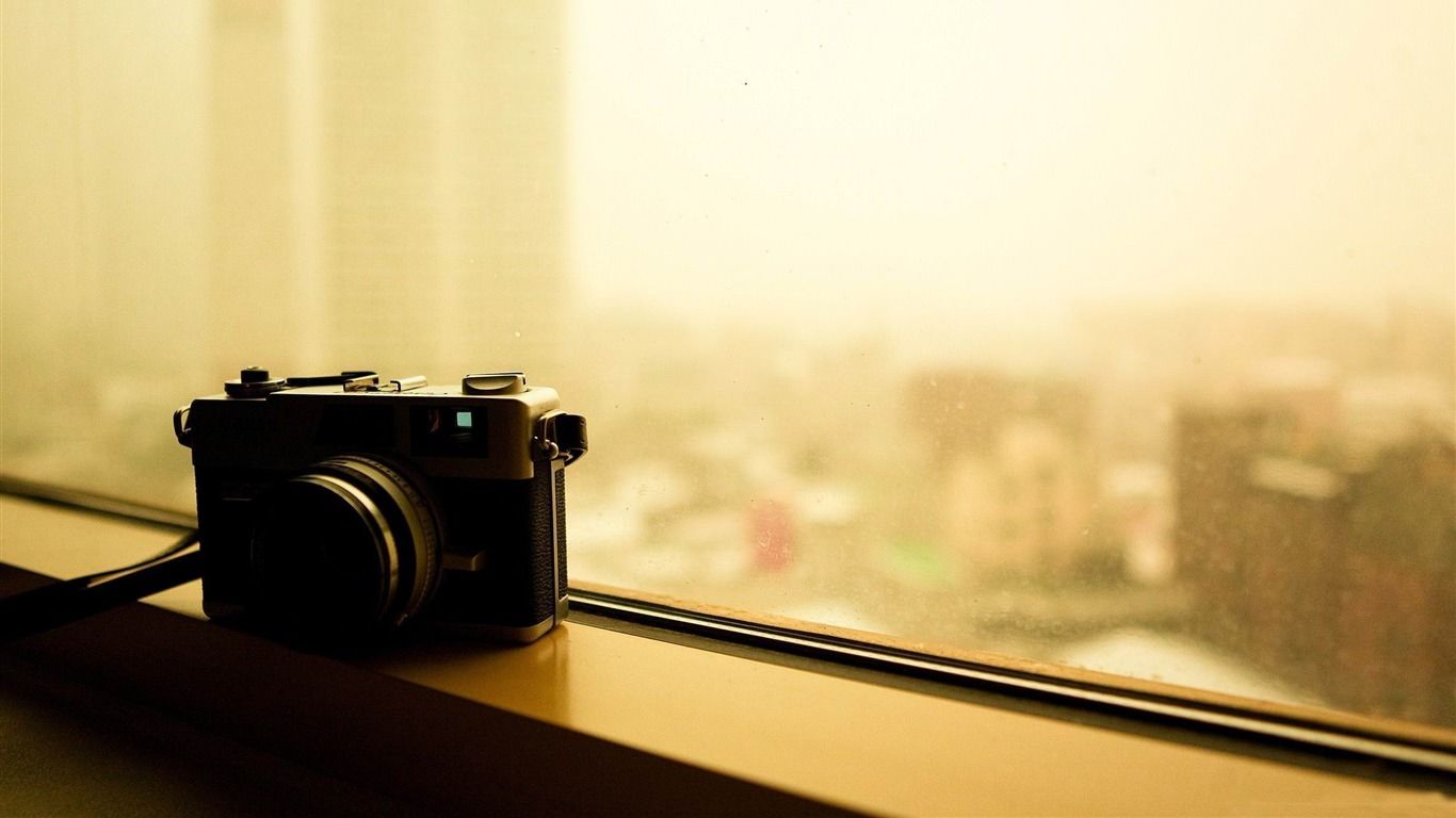 A camera sitting on the window sill - Photography