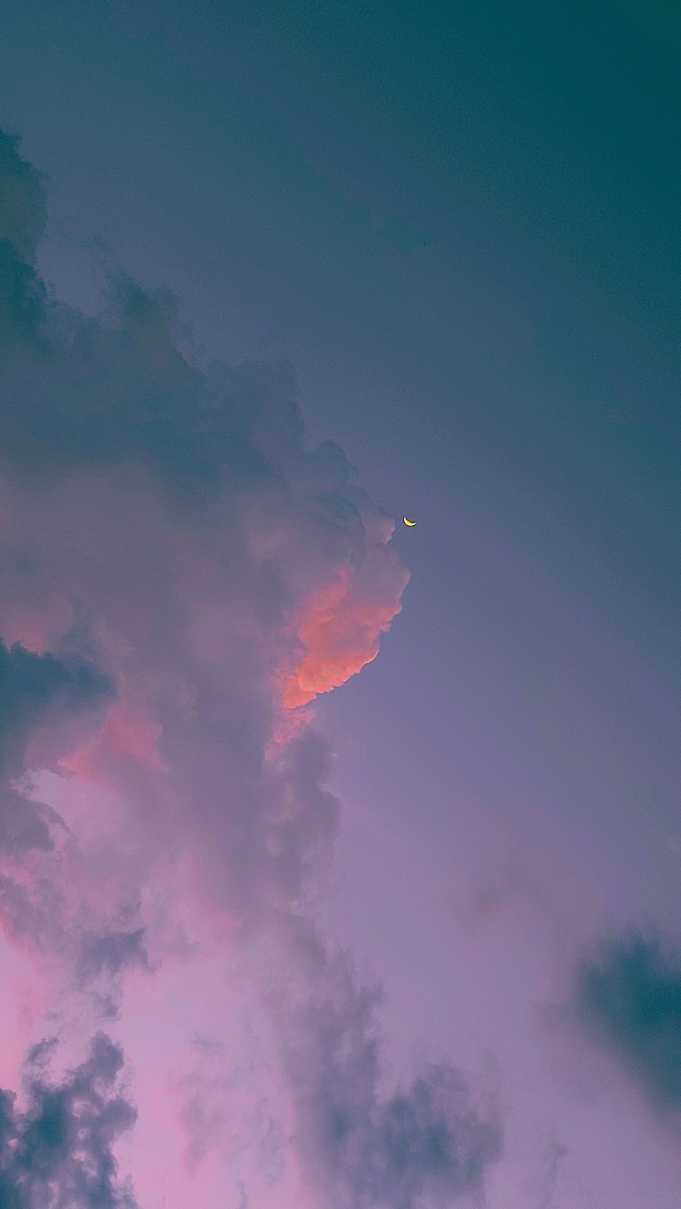 A plane flying through the clouds at sunset - Photography