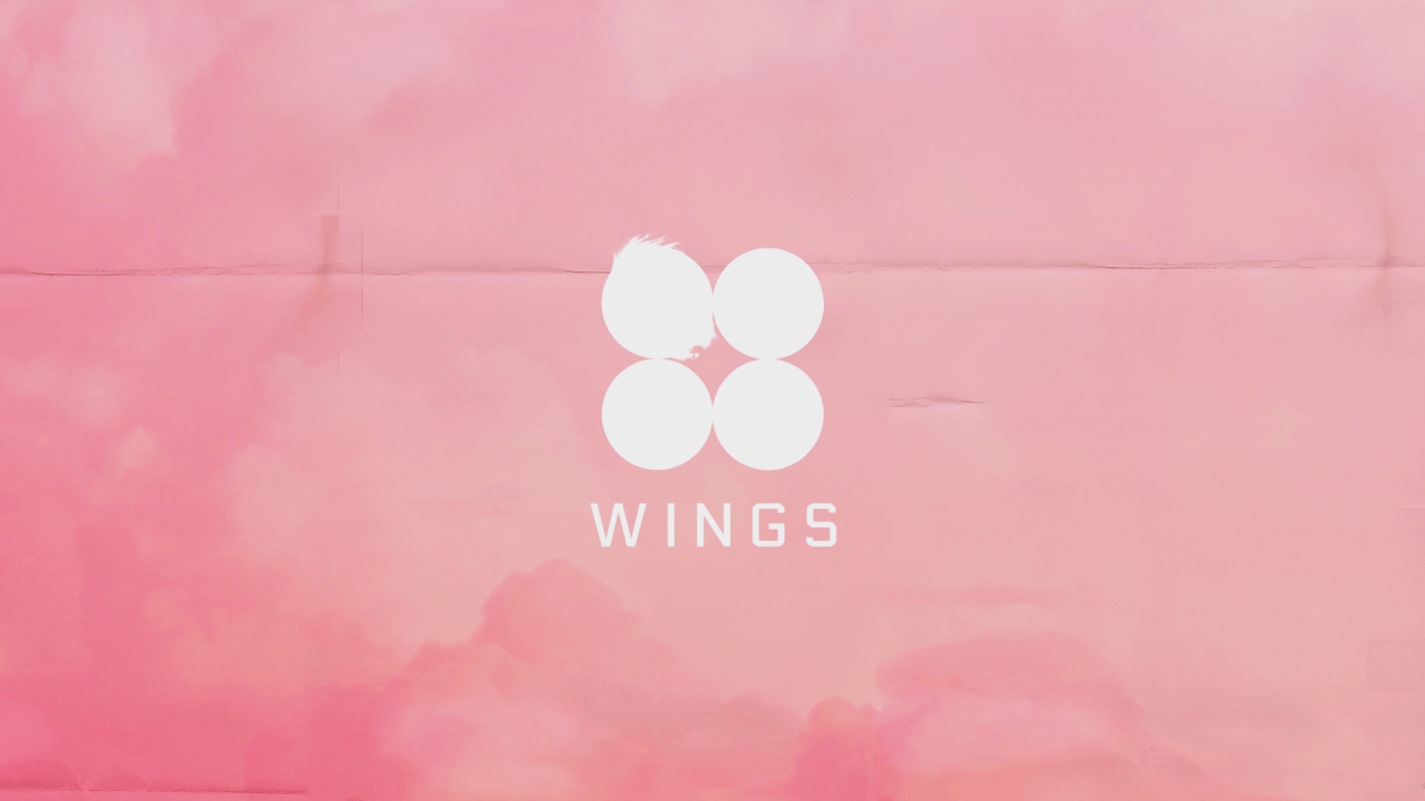A pink background with white wings on it - Desktop