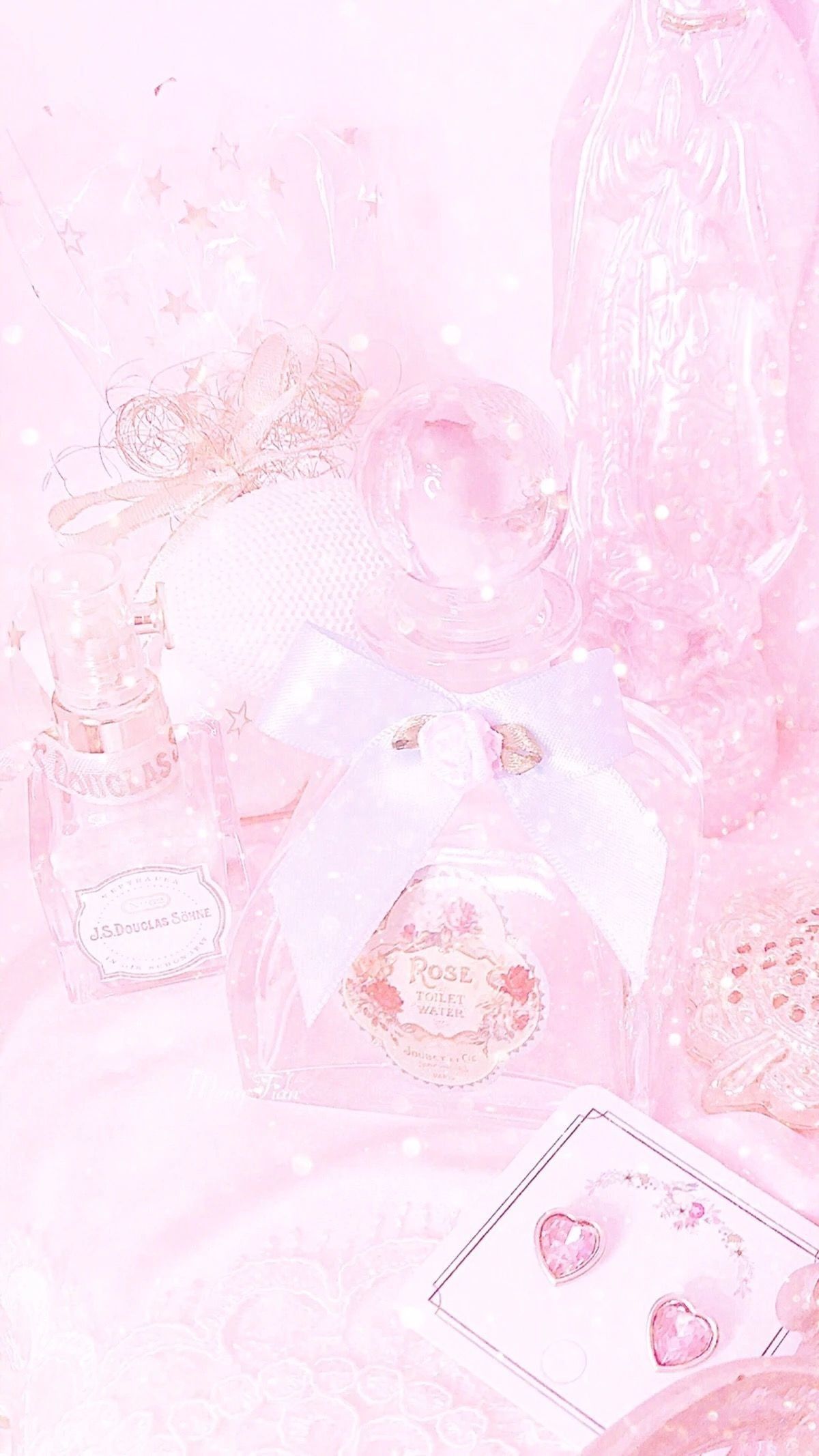 A pink aesthetic background image with a pink bottle of perfume, a pink bow, and a pink crystal ball. - Princess, diamond, pastel pink