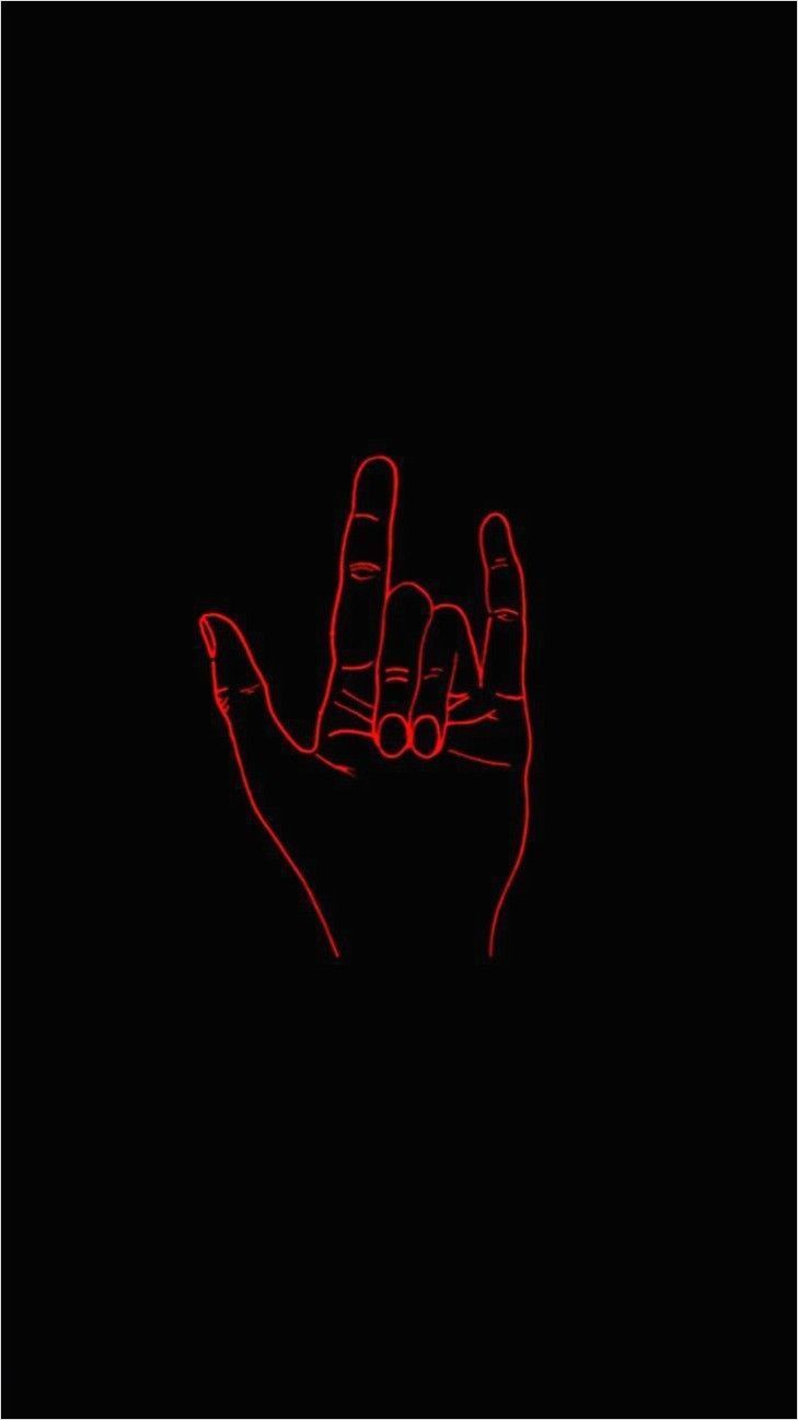 A red neon sign of a hand giving the finger against a black background - Punk