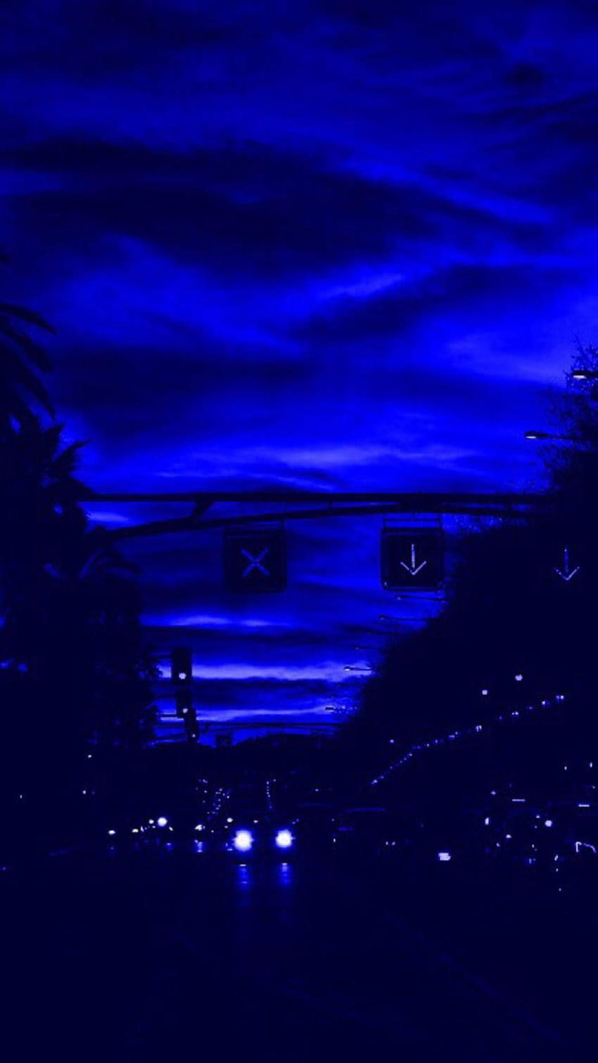 A blue sky with clouds and street lights - Dark blue