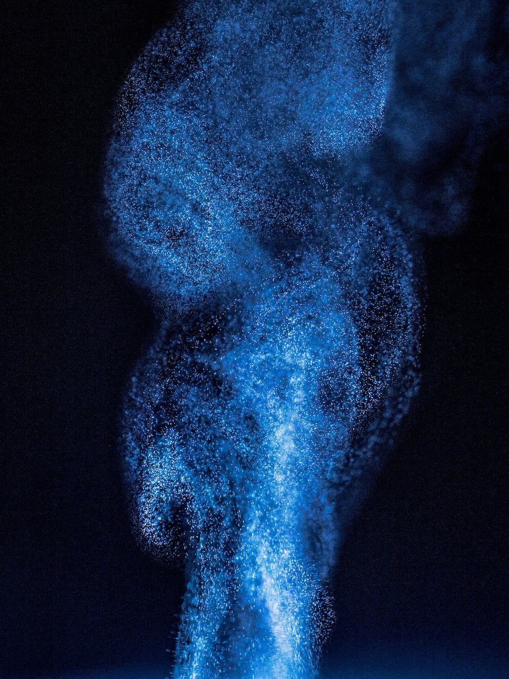 A blue smoke is coming out of the top - Dark blue, navy blue