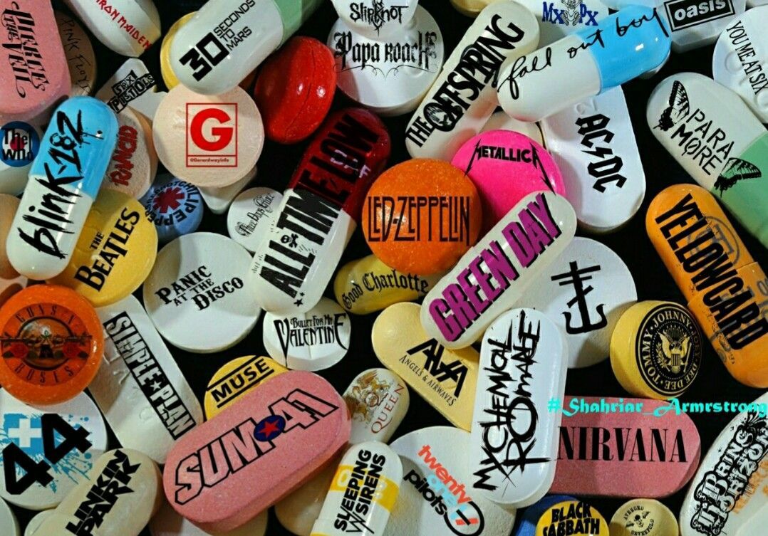A pile of different colored pills with rock band names on them - Punk