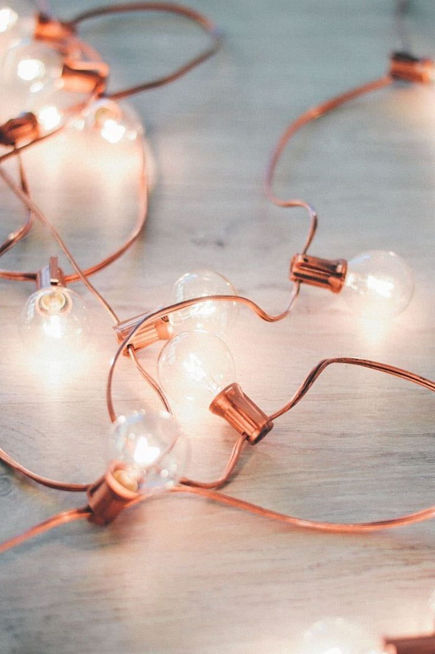 String lights on a wooden table - Rose gold, gold