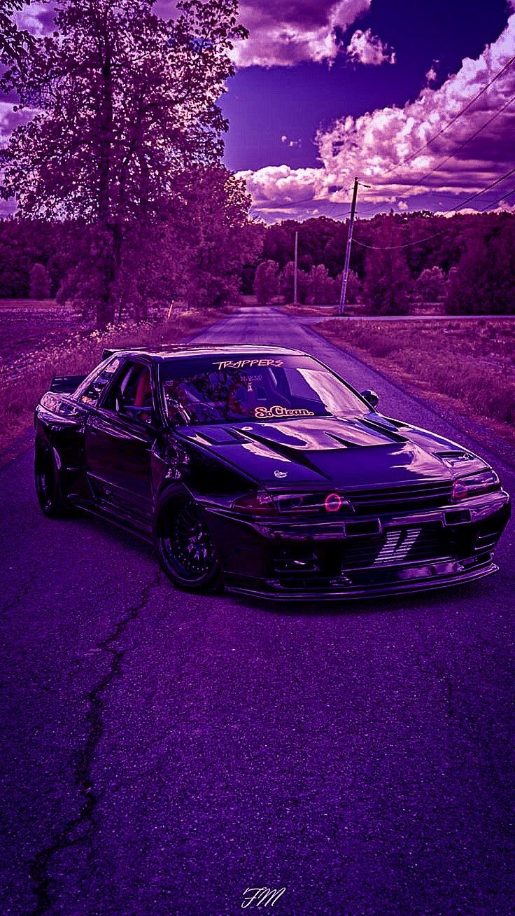 A purple car is parked on the road - JDM