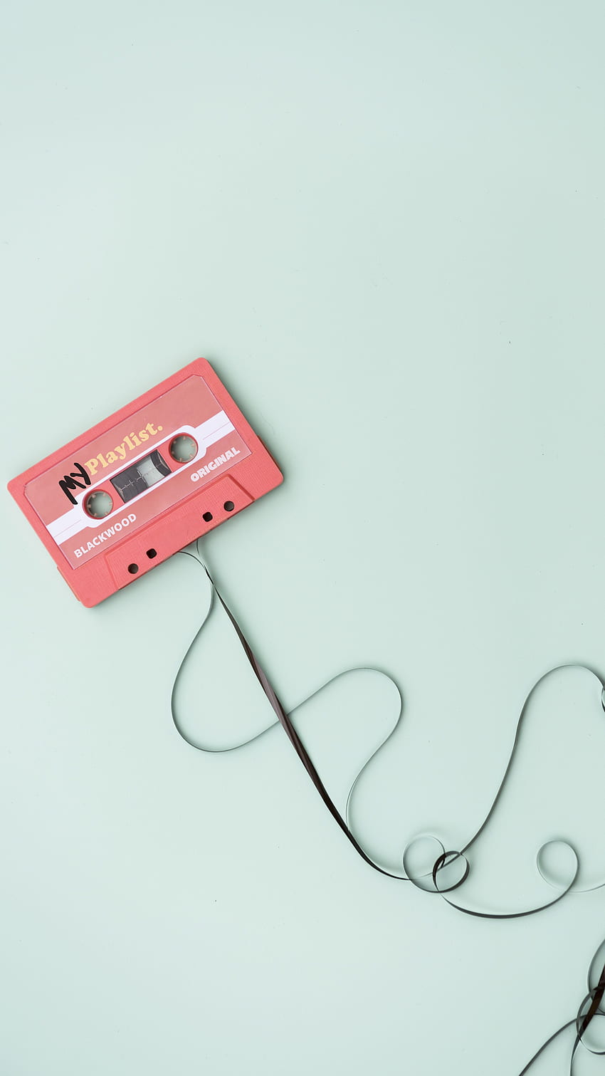 A cassette tape with wires attached to it - Music