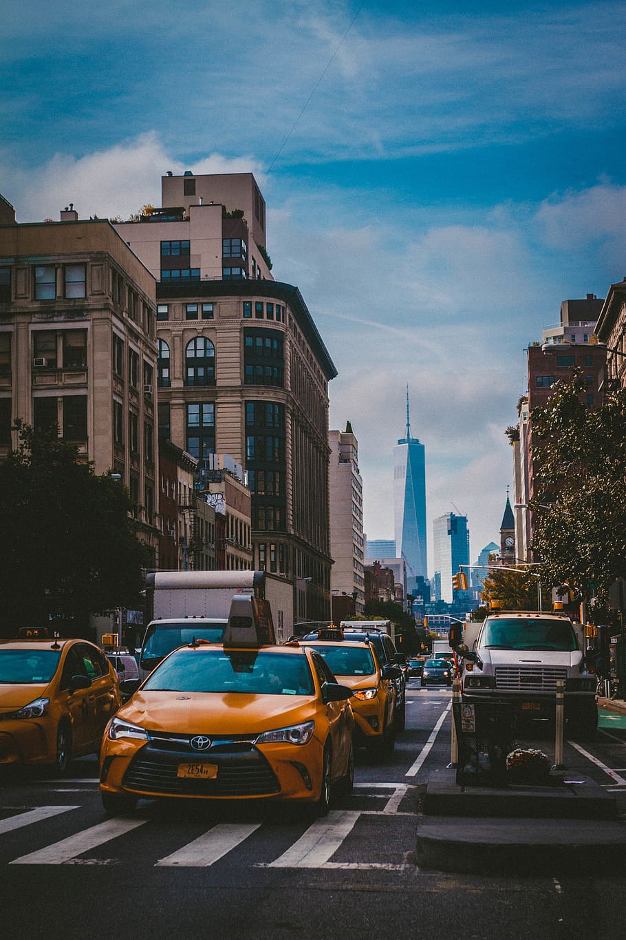 A busy city street with cars and taxis - New York