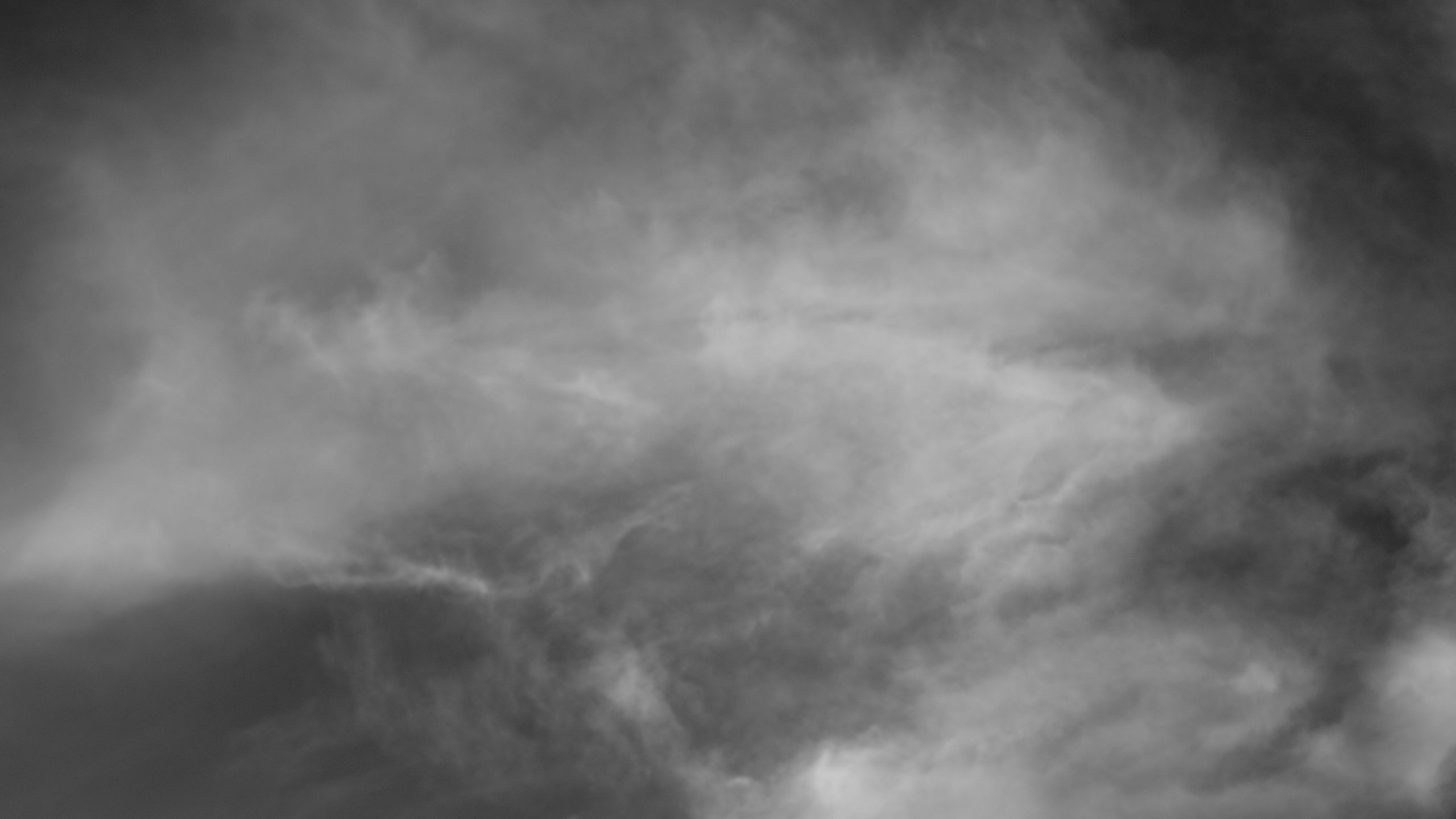 A black and white photo of clouds in the sky - Gray