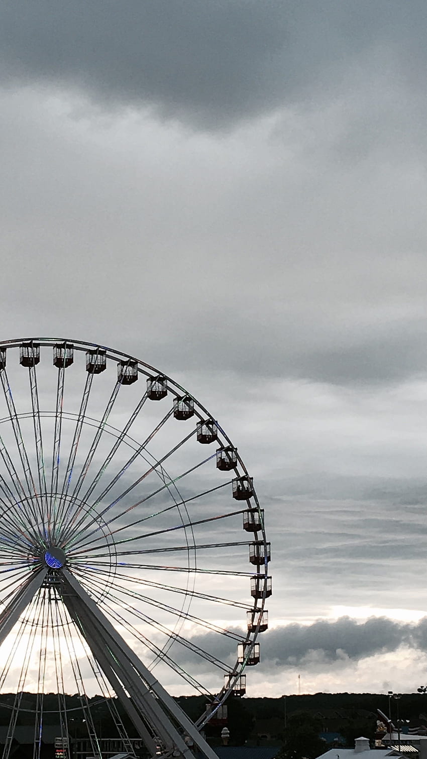 A ferris wheel is in the sky - Gray