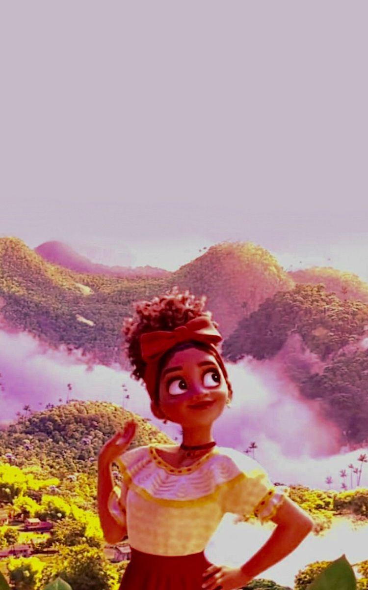 A black woman with a red headband stands in front of a mountain. - Encanto