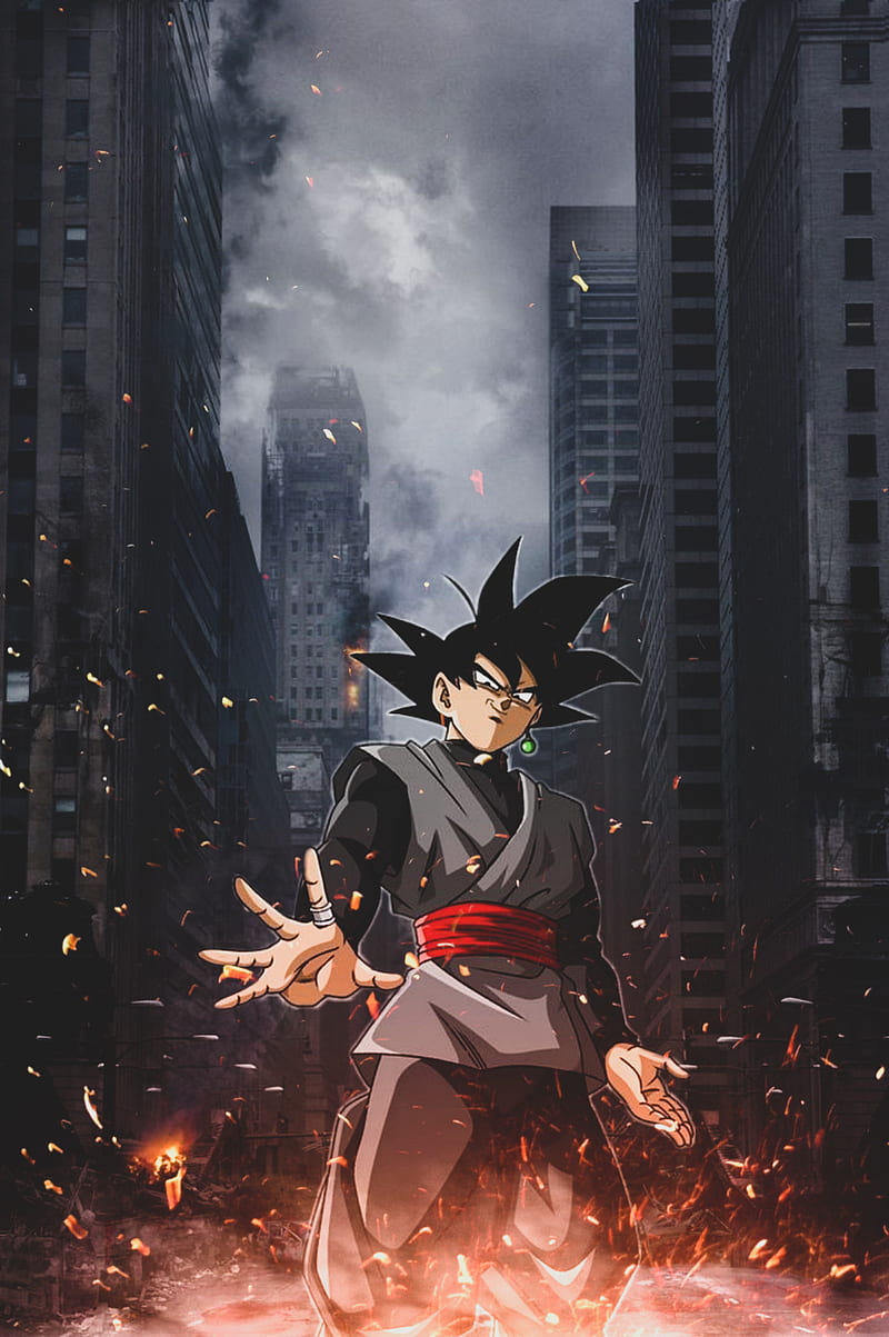 A man in black and red clothes standing on fire - Goku