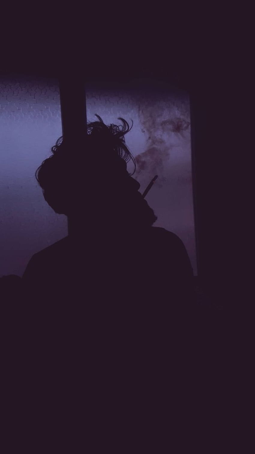 A man smoking in the dark with his back to us - Smoke