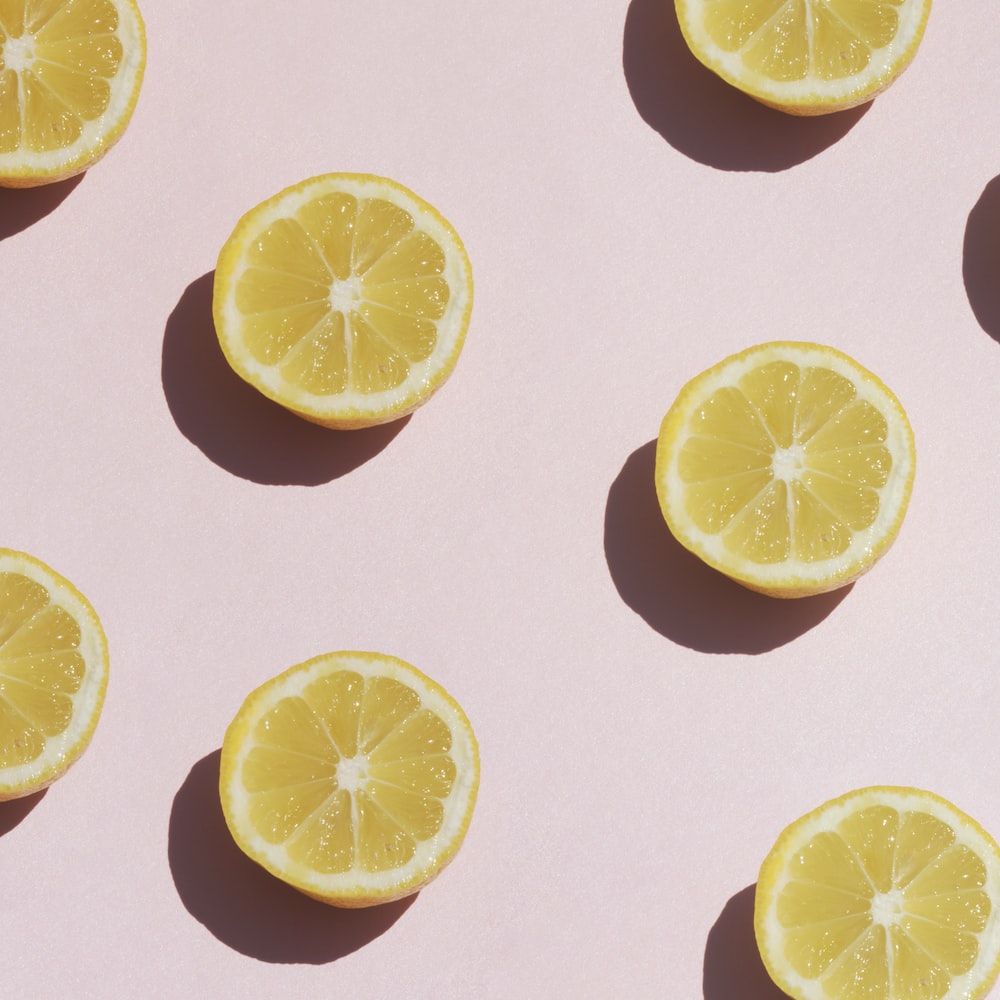 A group of lemons on top pink surface - Lemon