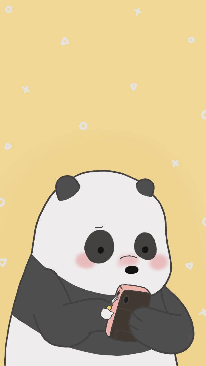 A panda bear holding an apple and looking at his phone - Panda