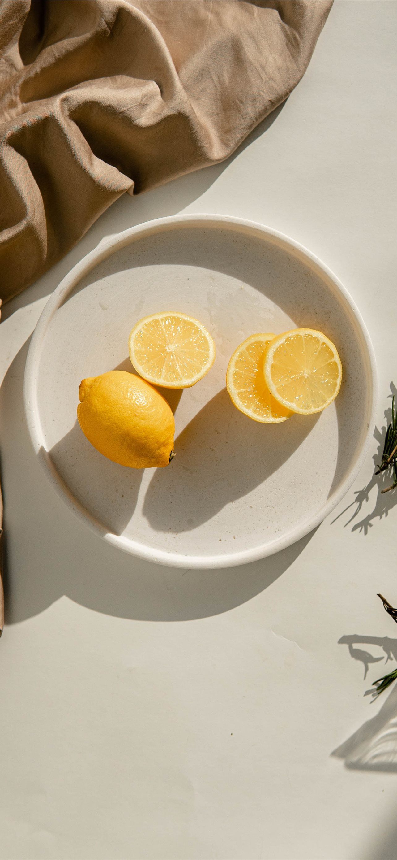 sliced lemon on white ceramic plate iPhone Wallpaper Free Download