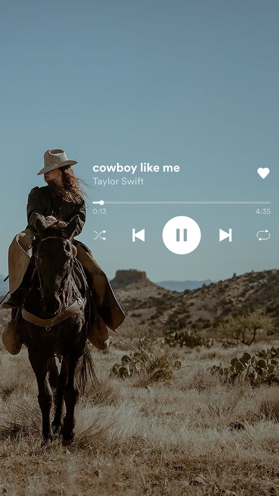 A woman riding on top of horse in the desert - Western