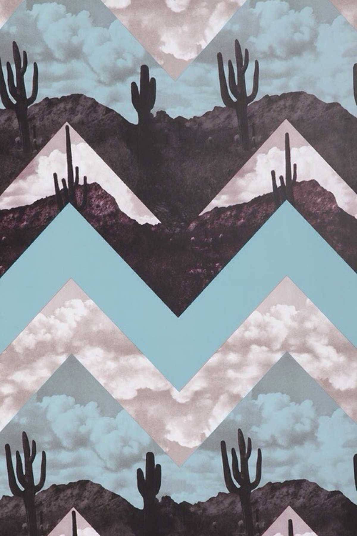 A cactus patterned wallpaper with mountains in the background - Western