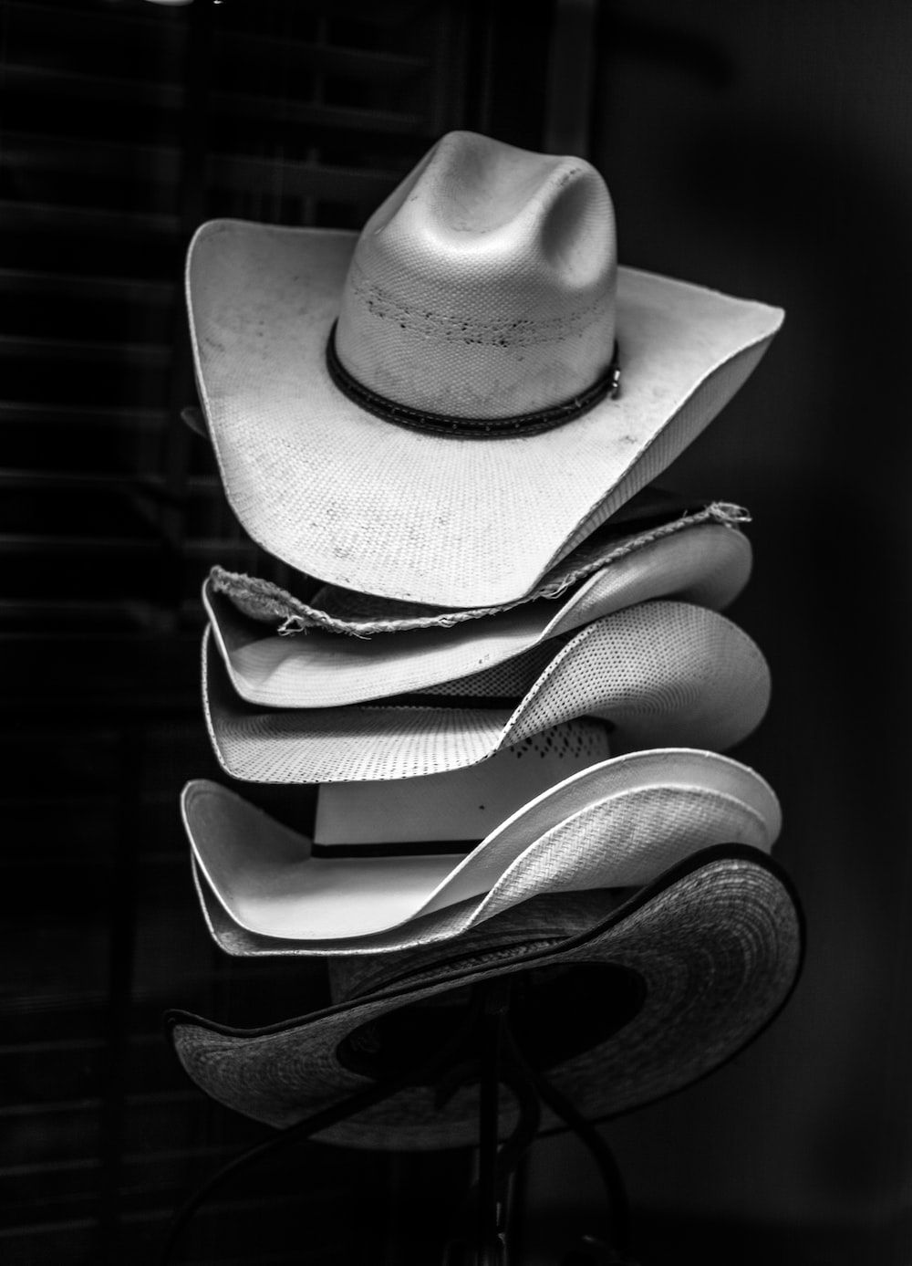 A stack of hats on top each other - Western