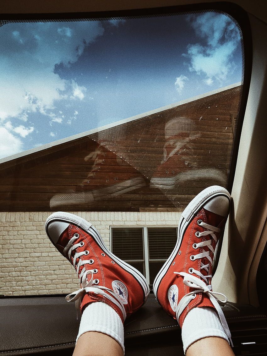 Red converse shoes in a car - Converse