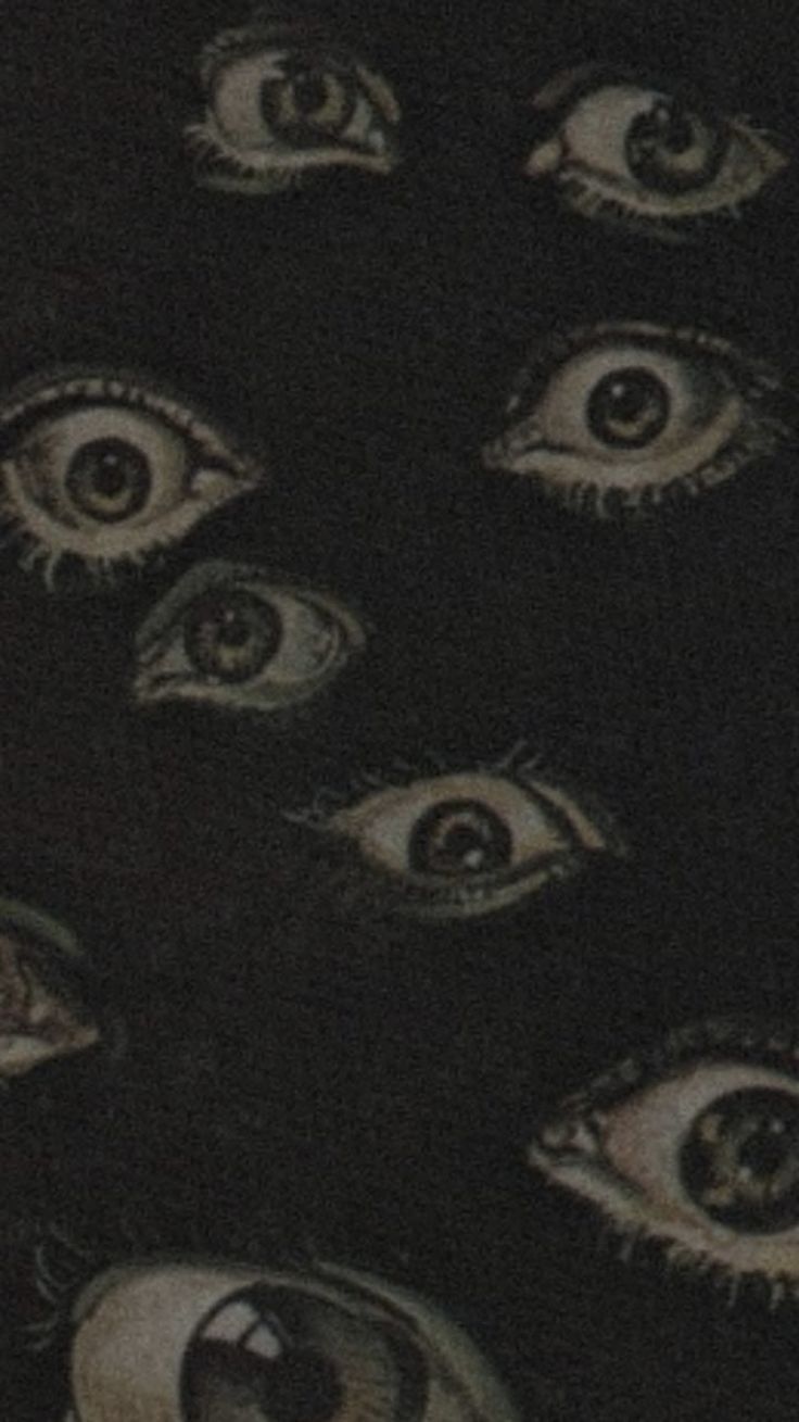 A black background with various sizes of eyes - Eyes
