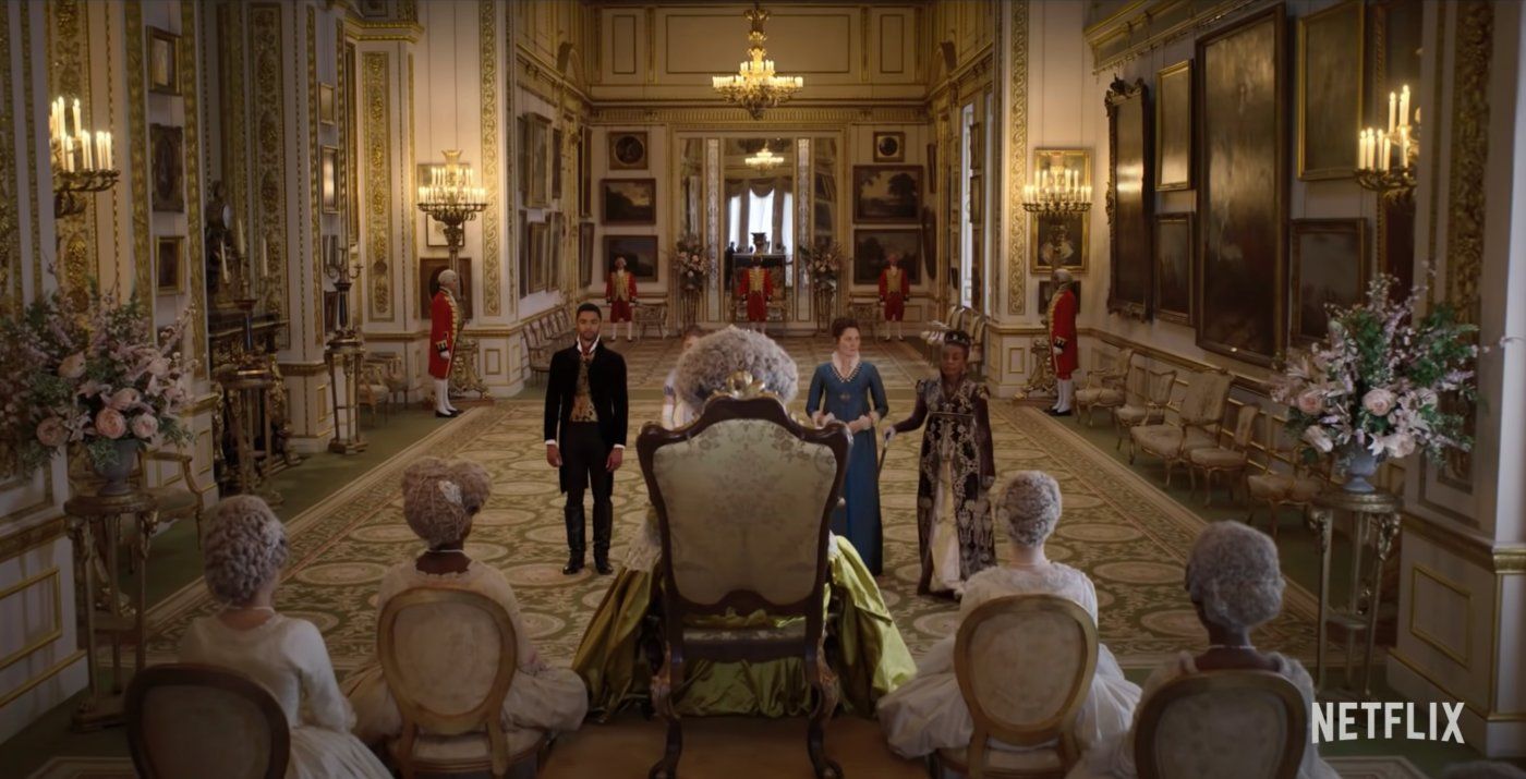 A still from The Crown showing the Queen and Philip in the throne room - Bridgerton