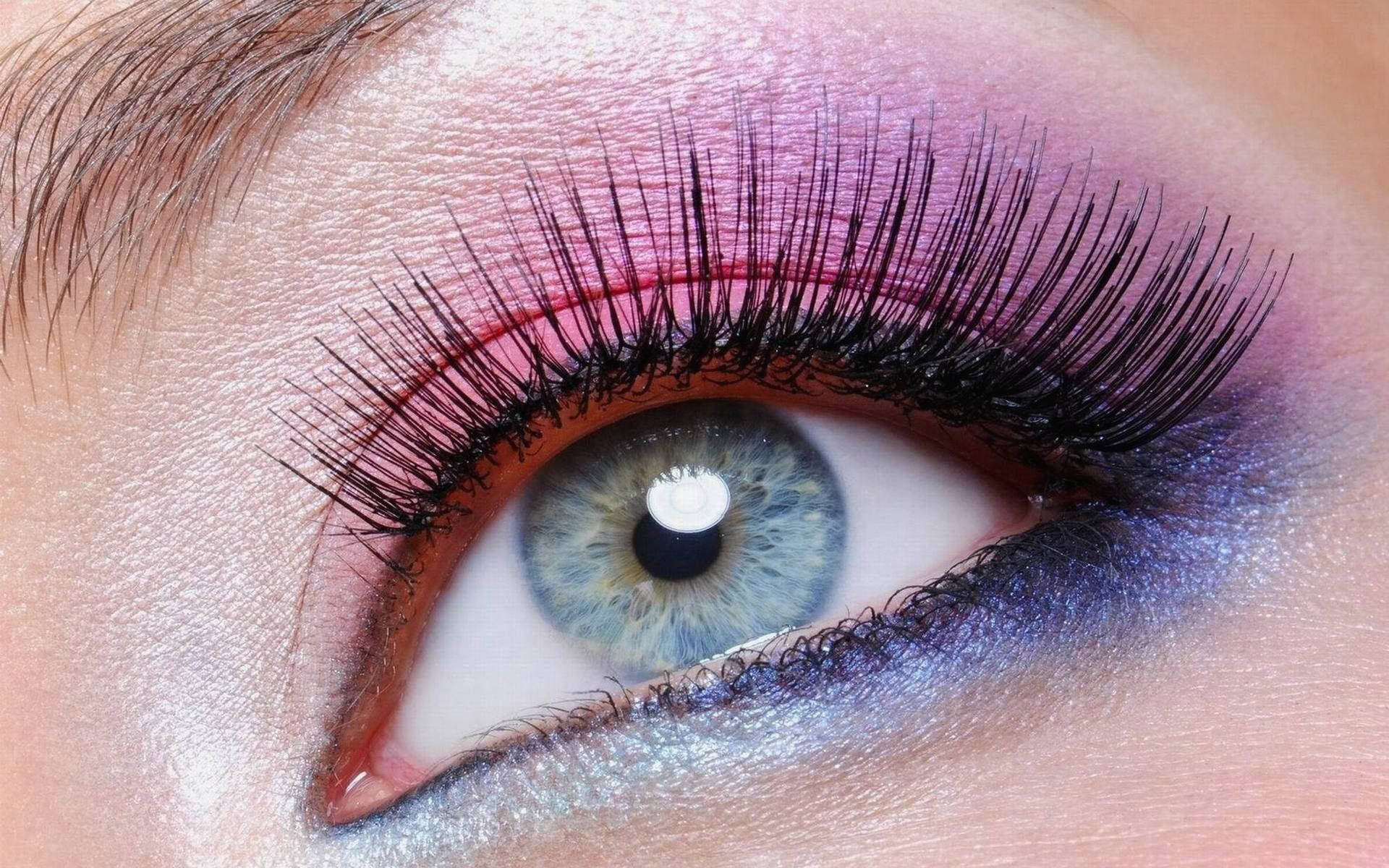 A woman's eye with blue eyes and pink eyelashes - Makeup