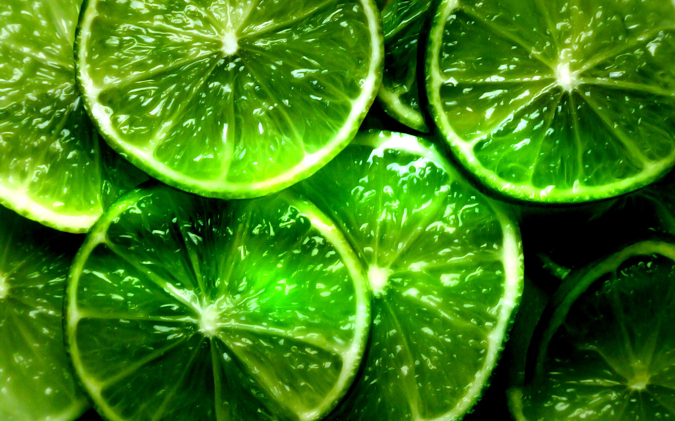 A close up of green lime slices - Lemon
