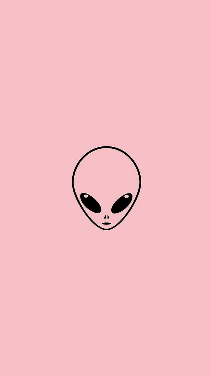 A pink background with an alien face - Alien