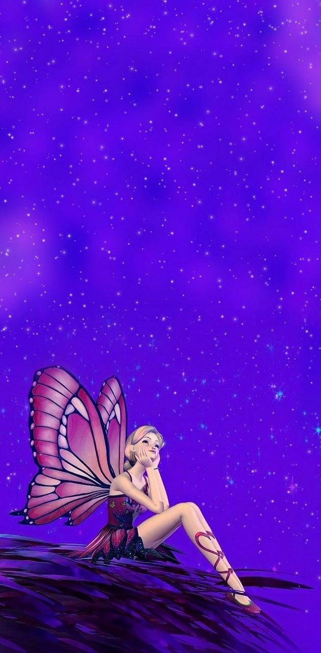 A fairy sitting on the ground with stars in her wings - Barbie