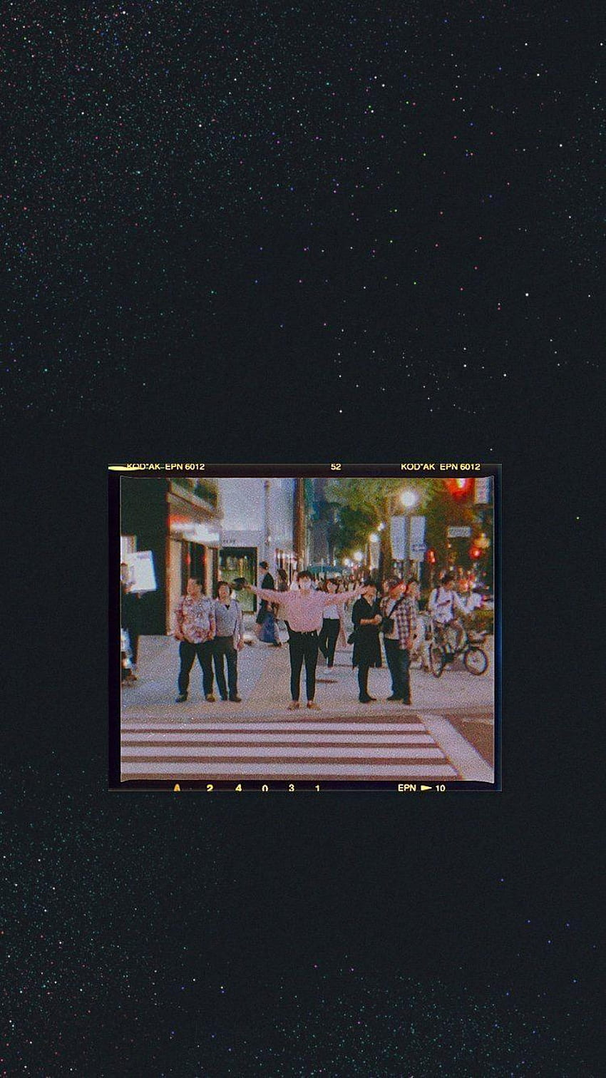 A group of people walking down a street at night - Grunge, vintage, BTS