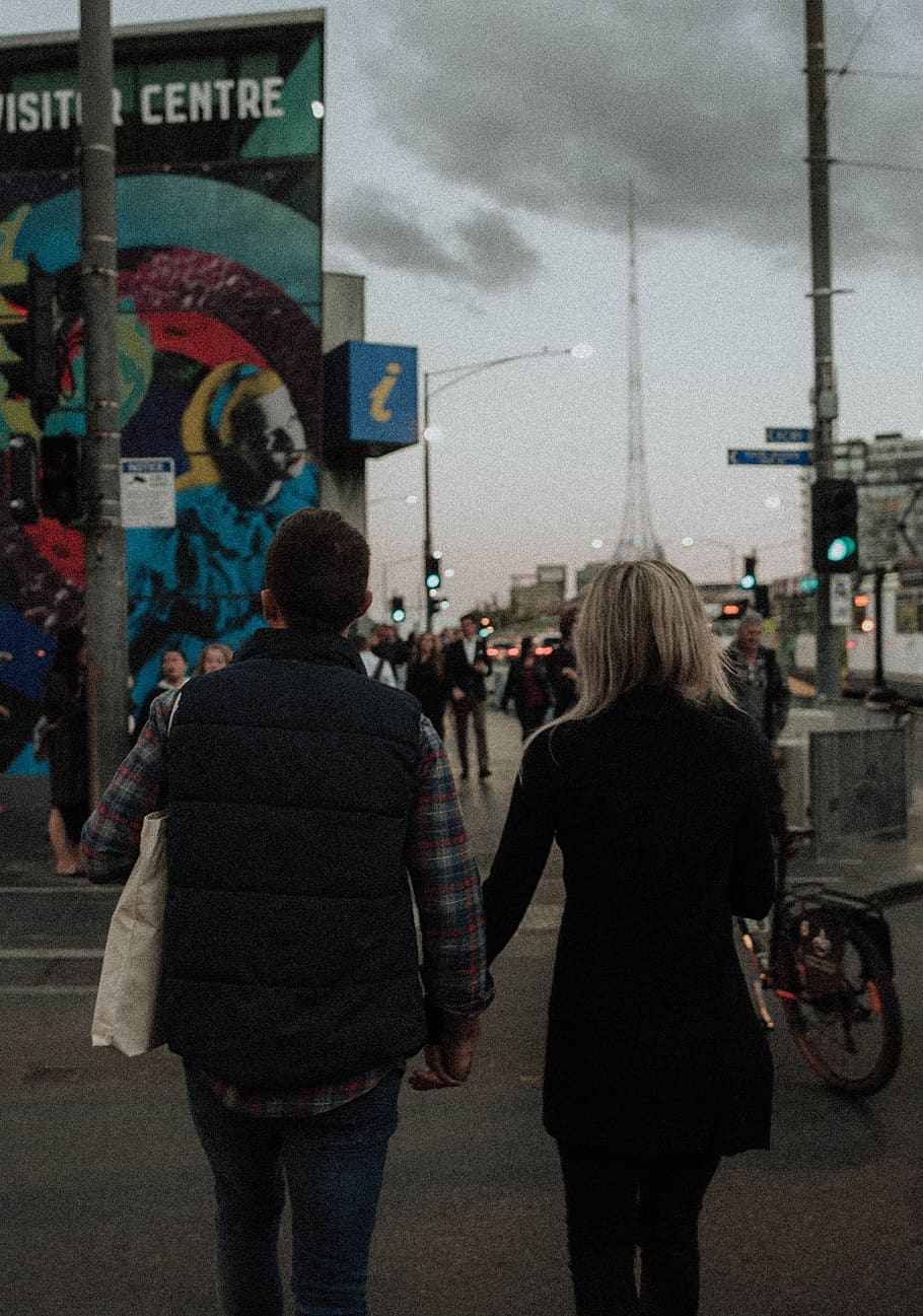 A couple holding hands while walking down a street - Grunge, retro