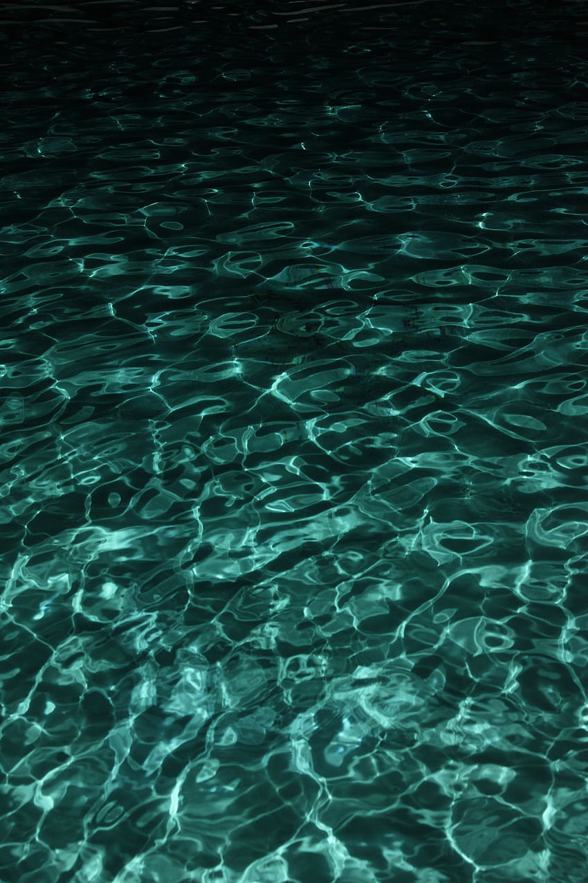 A close up of the water in an ocean - Teal