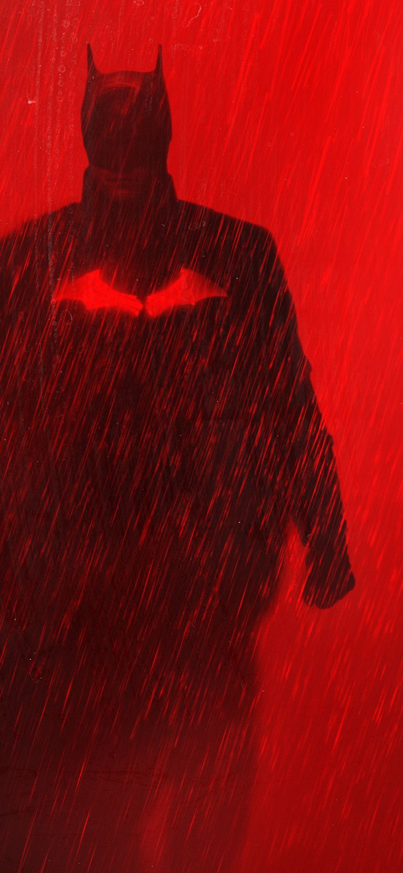 A batman in the rain with his cape - Batman