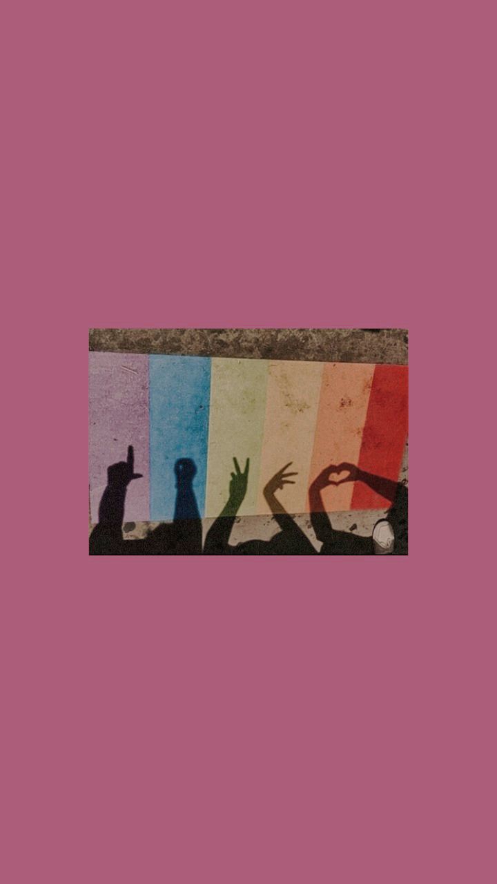 A rainbow colored image with hands in the air - LGBT, pride