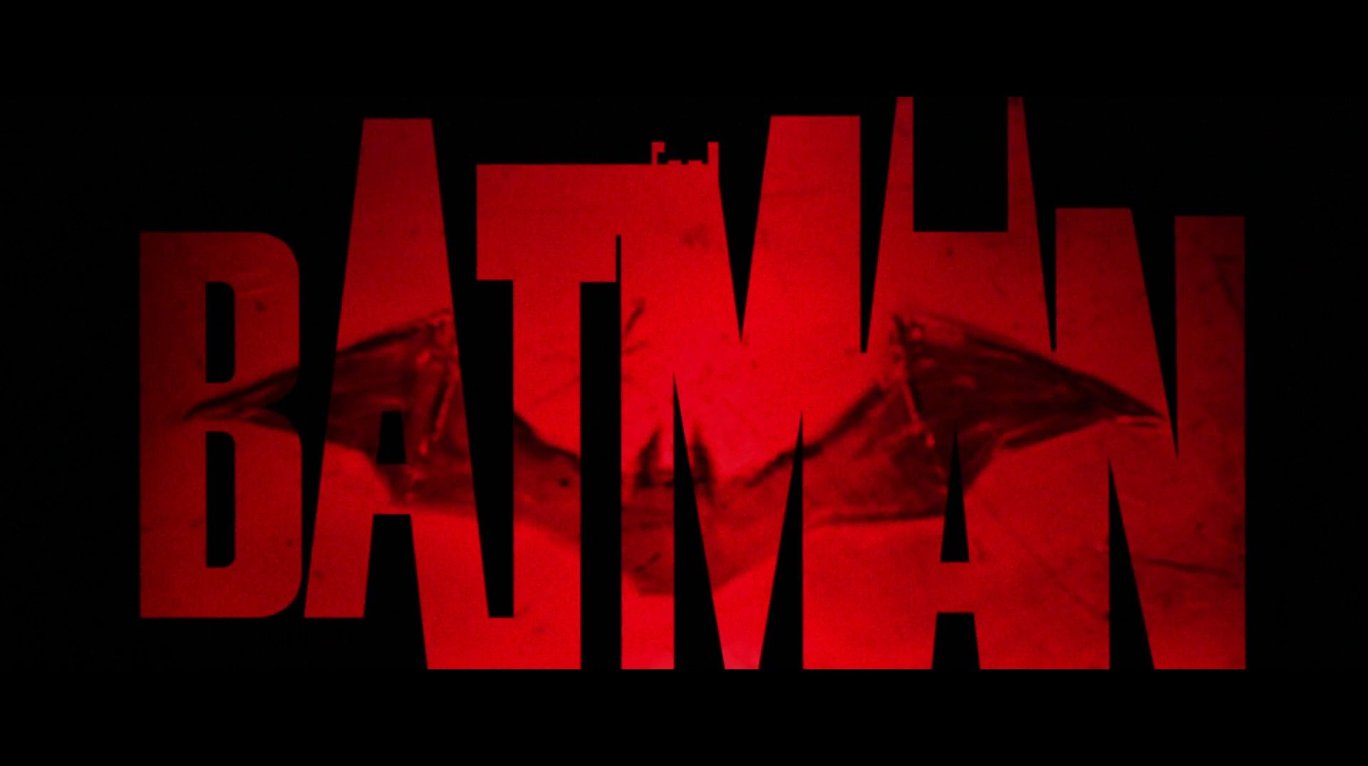 The batman logo is shown in red - Batman