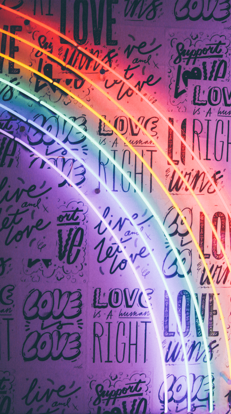 A wall of neon lights with the word love written all over it - LGBT, gay