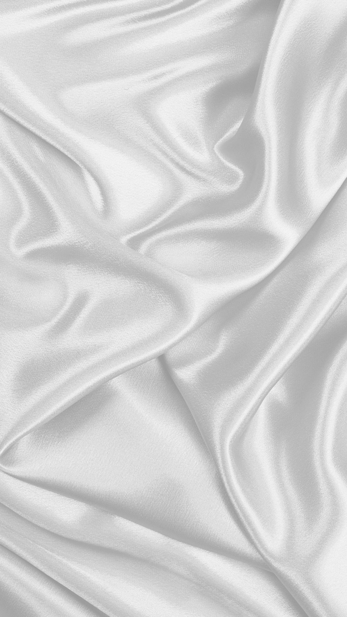 A white fabric background that looks like silk. - Silver