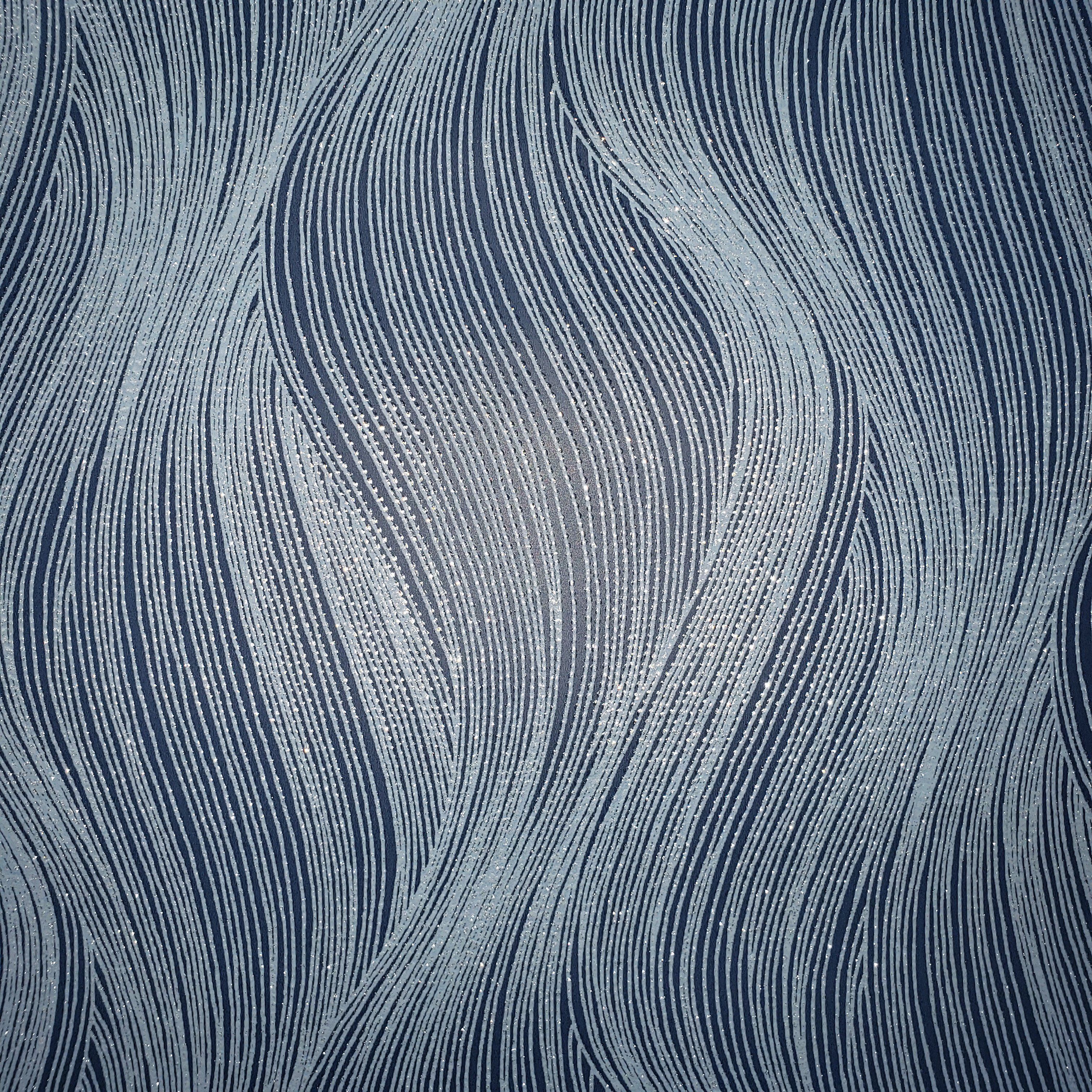 A close up of a blue and white patterned curtain - Silver