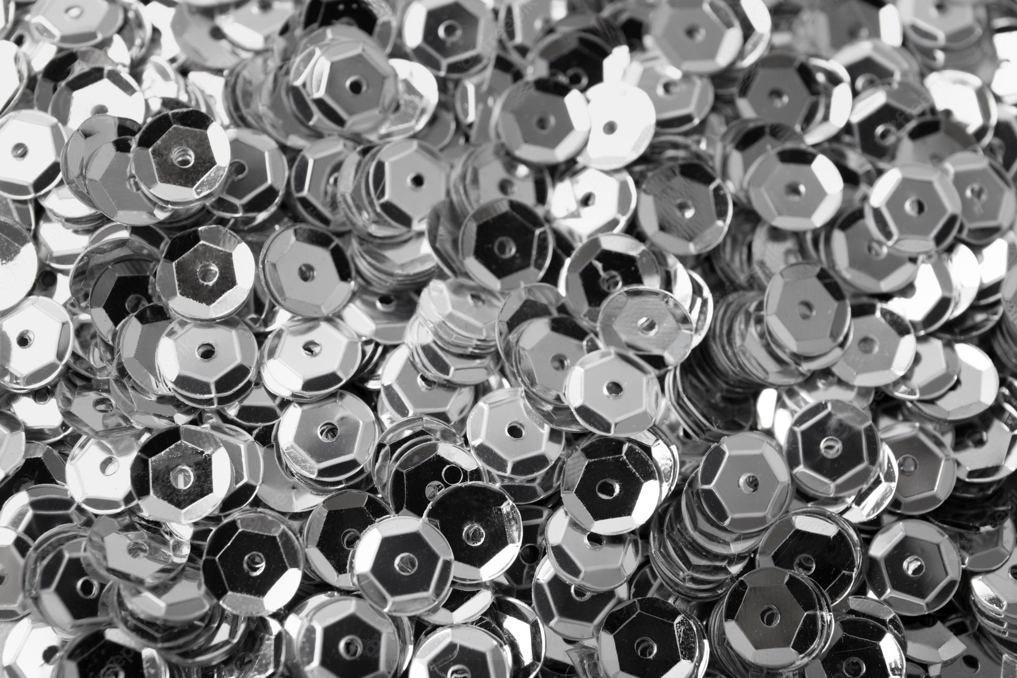A black and white photo of silver metal circles - Silver