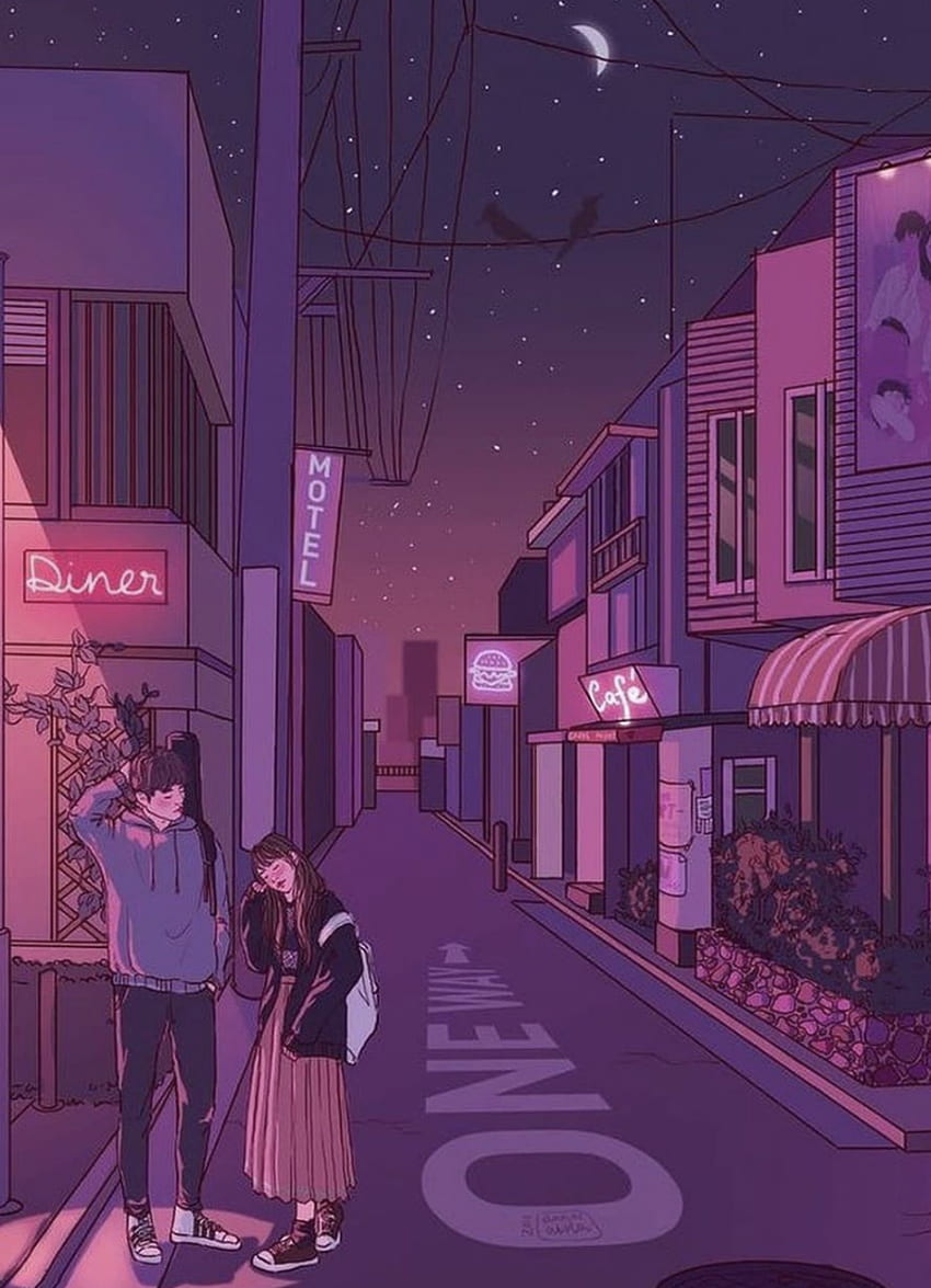 A couple standing on a street corner at night. - Tokyo