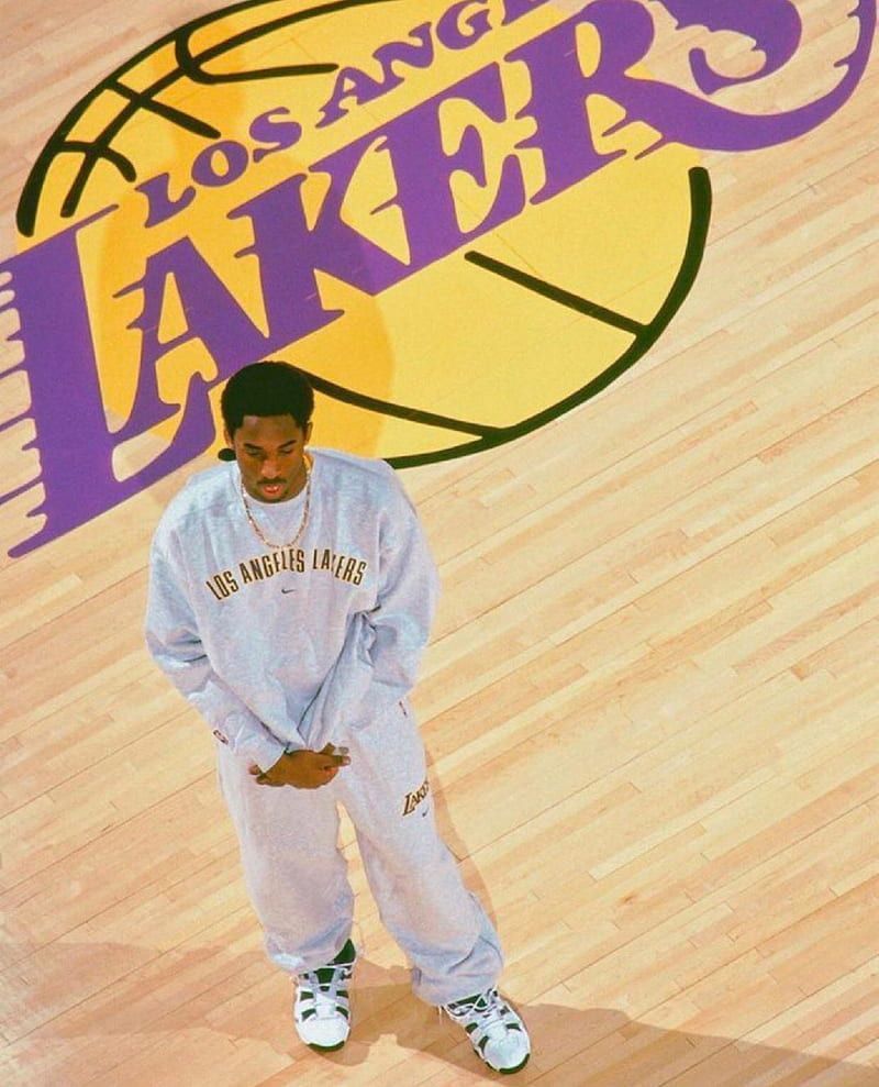 A man standing on the floor of an arena - NBA, Los Angeles Lakers, Kobe Bryant, basketball